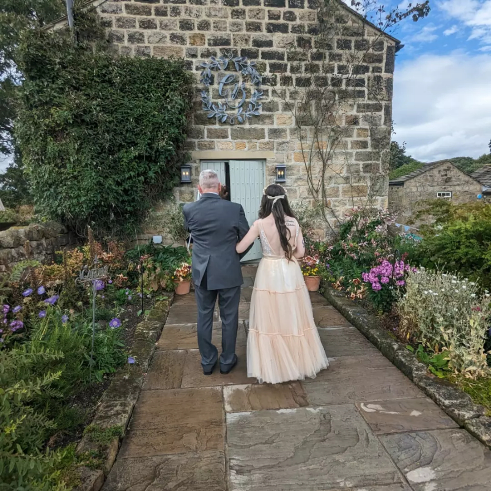 Yorkshire Dales Barn Wedding bride and father in front of barn