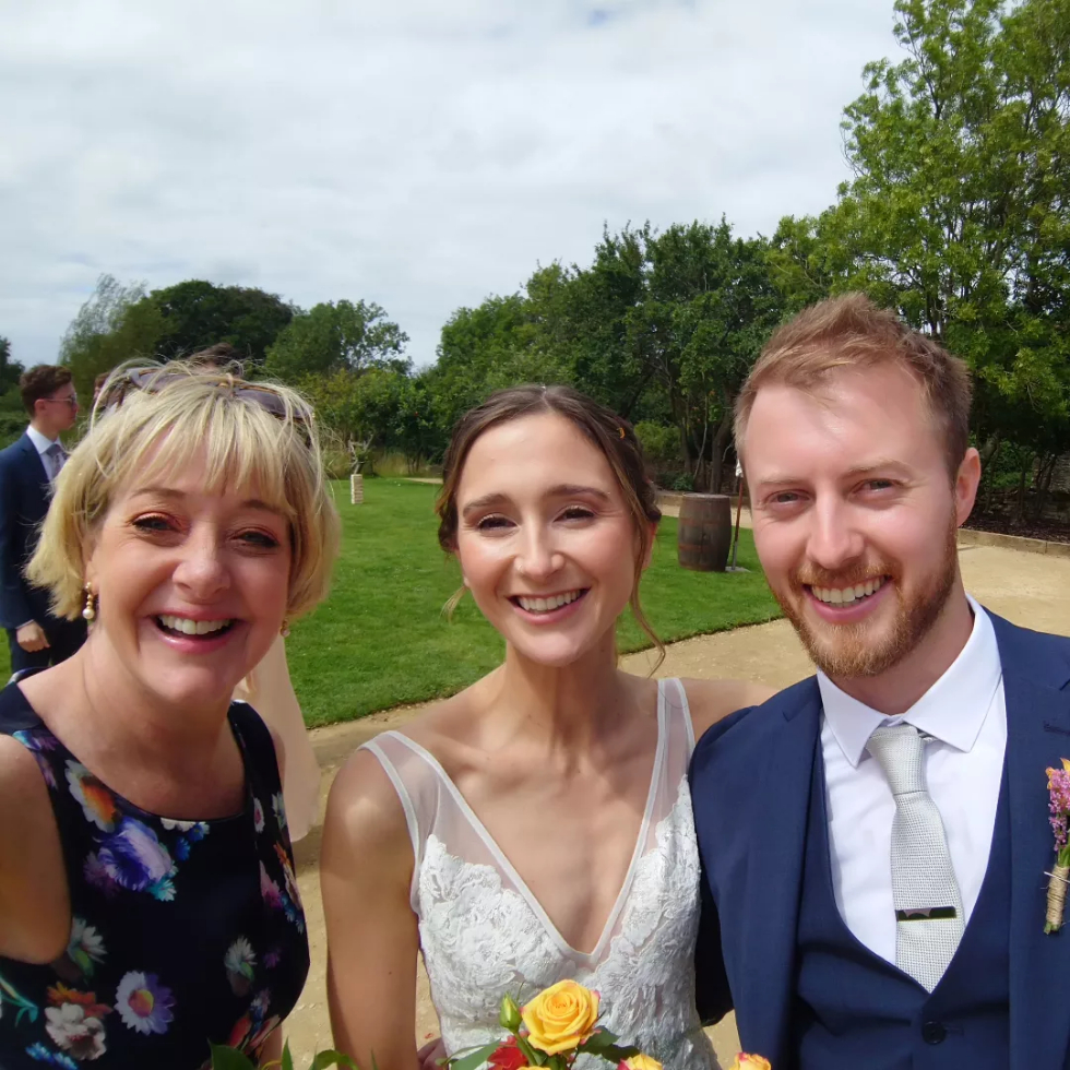 Celebrant with wedding couple selfie